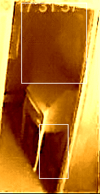 Animated captured picture from doll house cam on February 12, 2009 by Mytharasmom.  Top square is a woman's profile with a bun and lower square is a cat walking towards cam under the desk (look at the tail)!